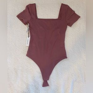 Brand new with tags, never worn, Aritzia short sleeved bodysuit